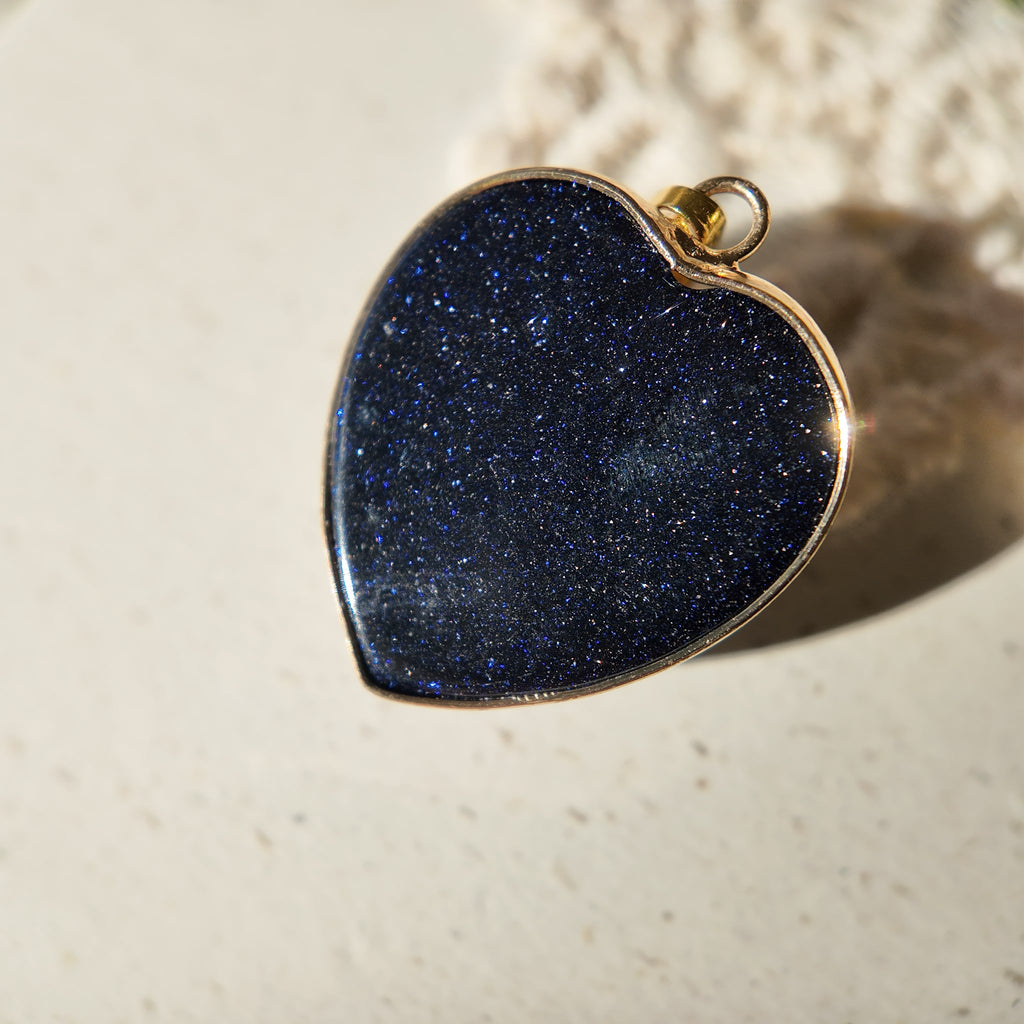 The reverse side of the "Galactic Faith" upcycled pendant, showing the clean and secure artisan construction of this unique piece of spiritual jewelry.