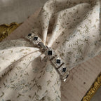 The Napier Art Deco panel bracelet worn on a wrist, showcasing its substantial size and the brilliant sparkle of its front-facing rhinestones.