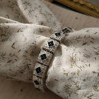 The Napier Art Deco panel bracelet worn on a wrist, showcasing its substantial size and the brilliant sparkle of its front-facing rhinestones.