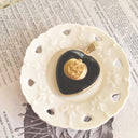 Atmospheric flatlay photography of the vintage component necklace, styled to evoke mystery, playful spookiness, and gothic charm.