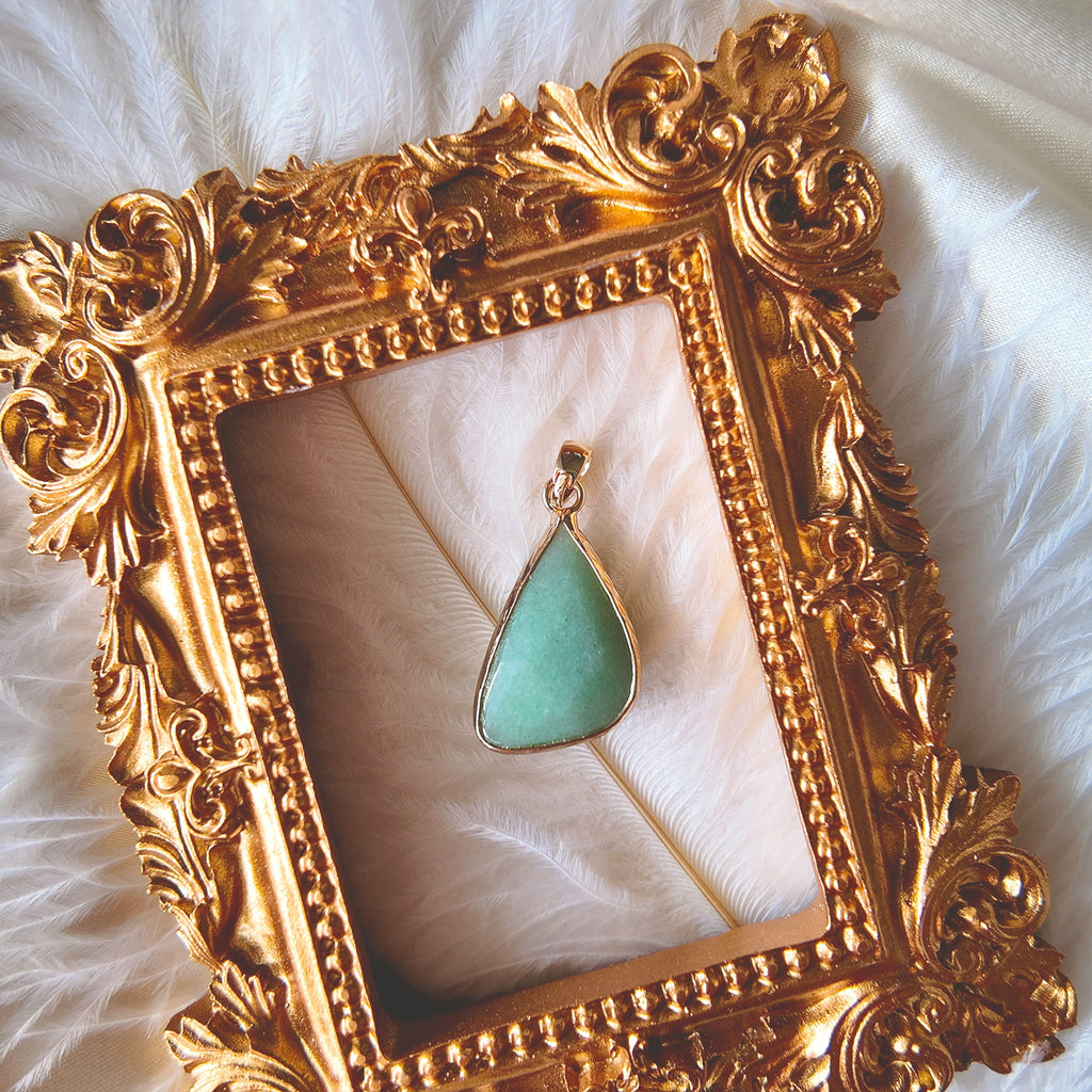 The reverse side of the upcycled Green Aventurine charm, showcasing the clean bezel setting and the beautiful, natural shimmer of the stone.