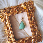 The reverse side of the upcycled Green Aventurine charm, showcasing the clean bezel setting and the beautiful, natural shimmer of the stone.