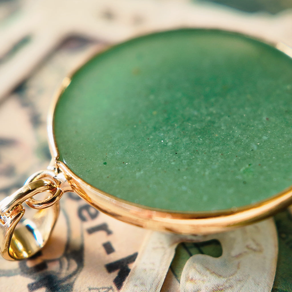 The reverse side of the upcycled Green Aventurine charm, showcasing the clean bezel setting and the quality of the handcrafted assembly.