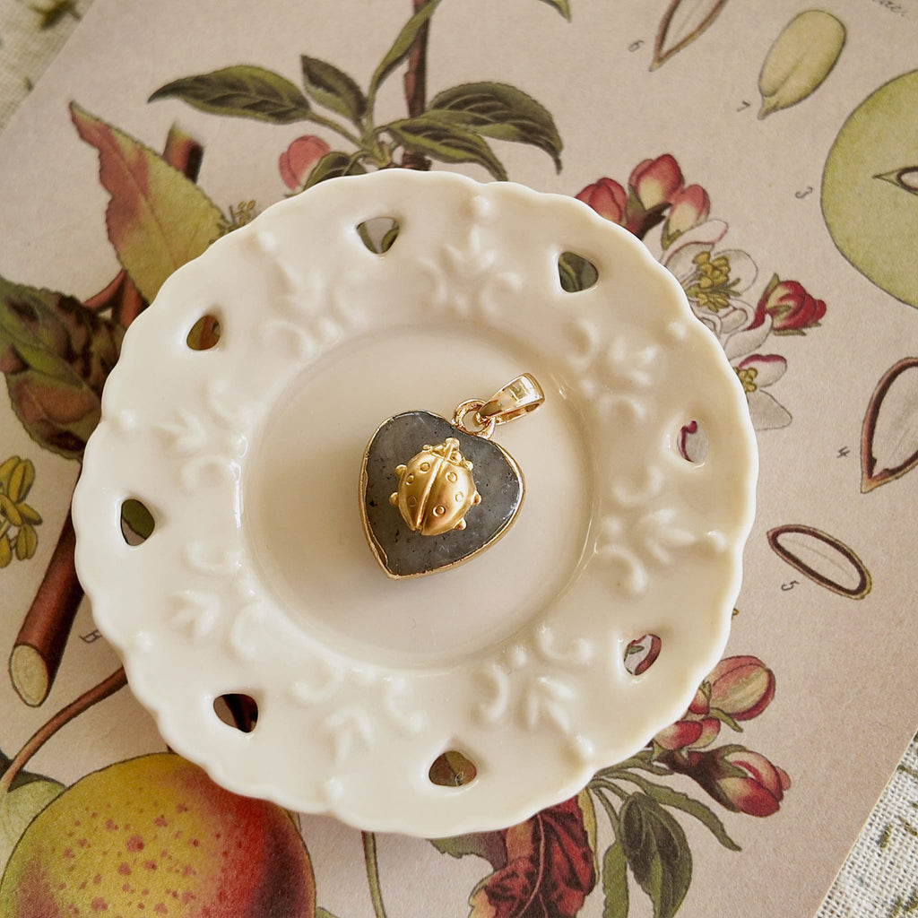 Atmospheric flatlay photography of the vintage component necklace, styled to evoke quiet waiting and hidden magic.