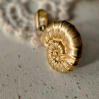 Seashell jewelry, gold-plated charm, ocean theme.