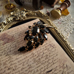 An angled view of the "Prima Ballerina" brooch, highlighting the classic, layered open-back construction typical of high-end DeLizza & Elster jewelry.