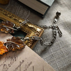 A detailed photo honestly showing the heavy aging and visible rust on the extender chain of the Lisner necklace, which is sold as-is at a reduced price.