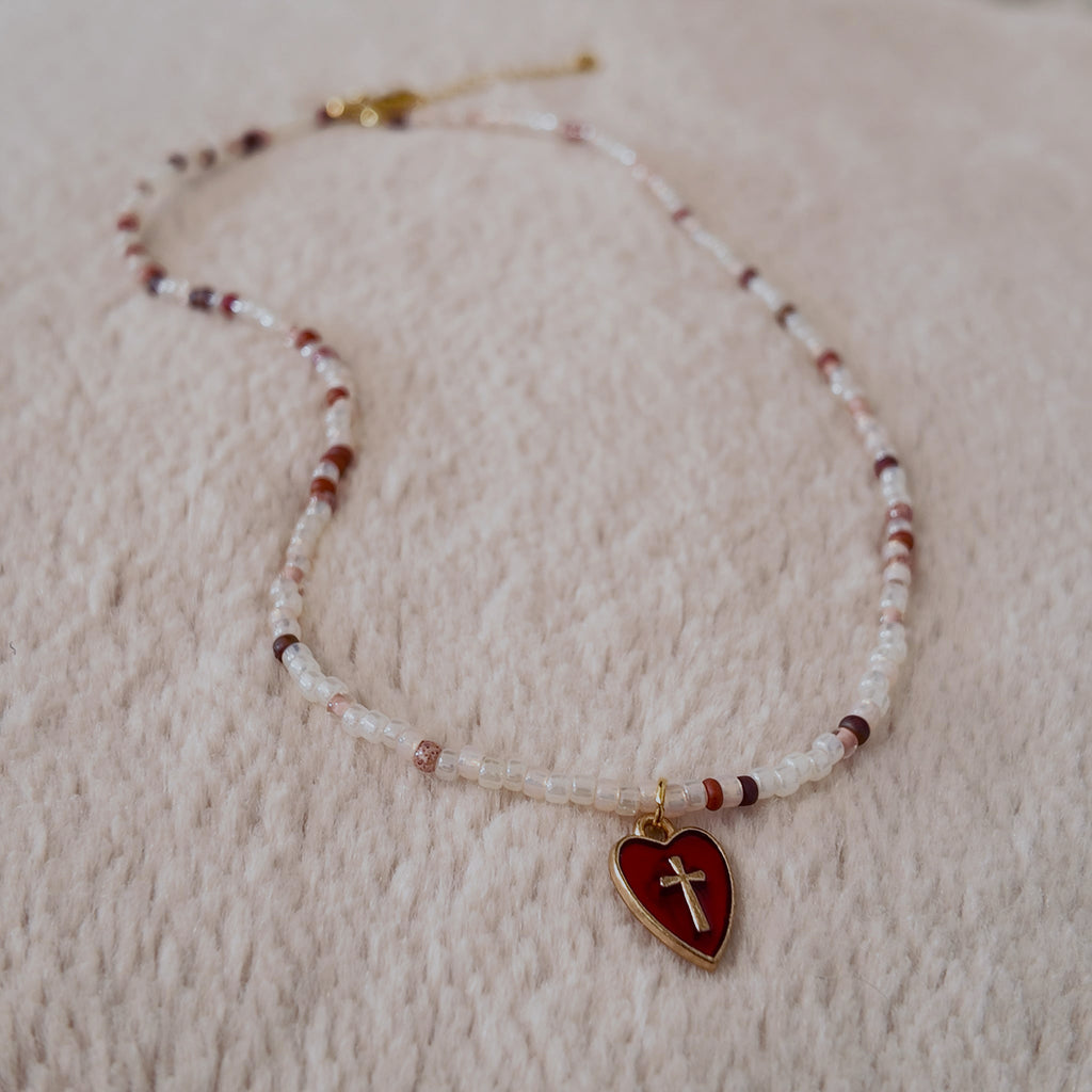 The "Sacred Healer" choker styled with a white rose and a drop of red to emphasize its "Sacred Romance" and "Clinical Chic" aesthetic, a talisman of redemption.