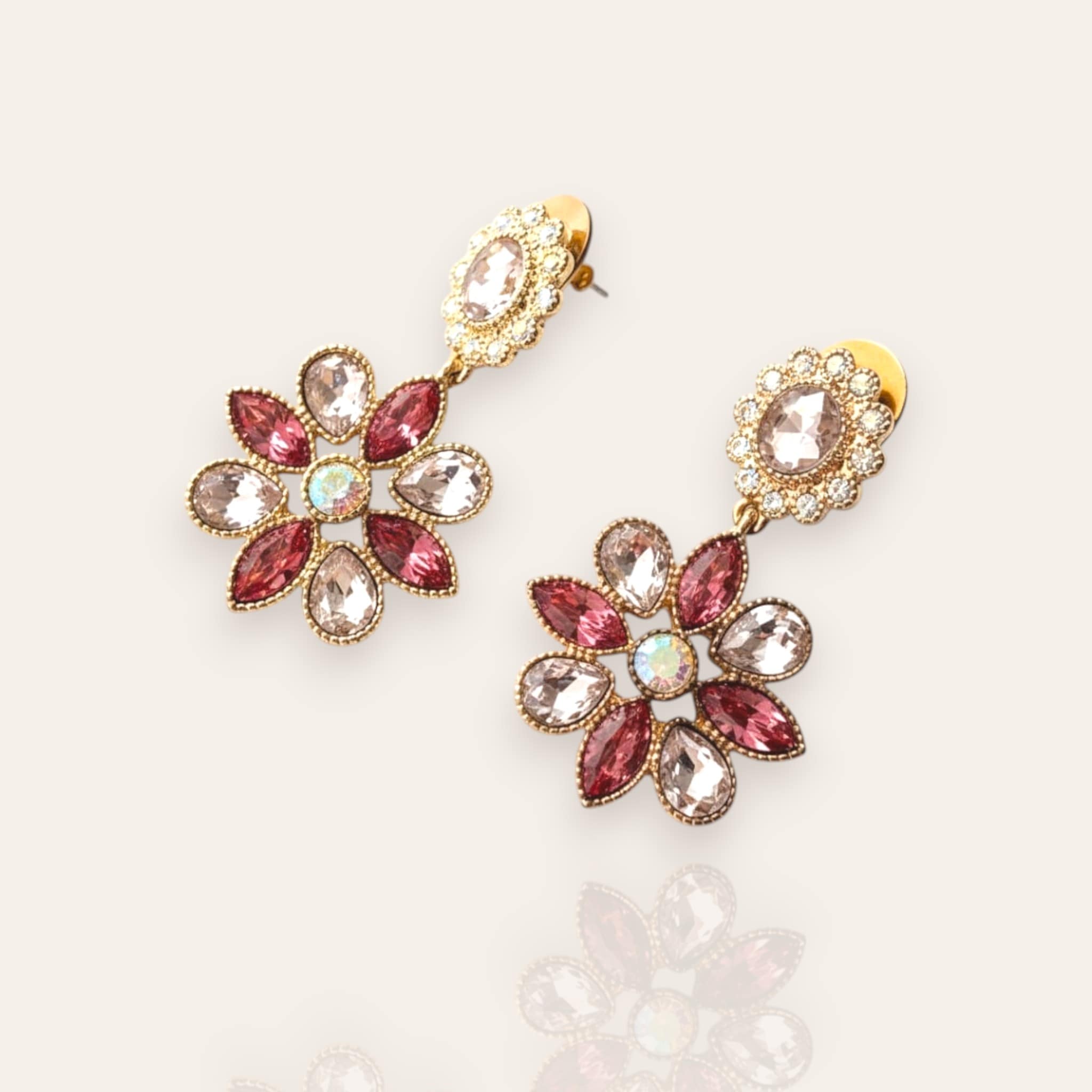 The "Garden is in Full Bloom," a pair of vintage Monet statement chandelier earrings, featuring a two-tiered floral design with pink crystals and faux opals.