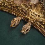 A close-up detailing the rich, textured brushed gold finish on the Napier leaf design, crafted to catch the light like real leaves in the sun.