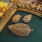 A close-up detailing the rich, textured brushed gold finish on the Napier leaf design, crafted to catch the light like real leaves in the sun.