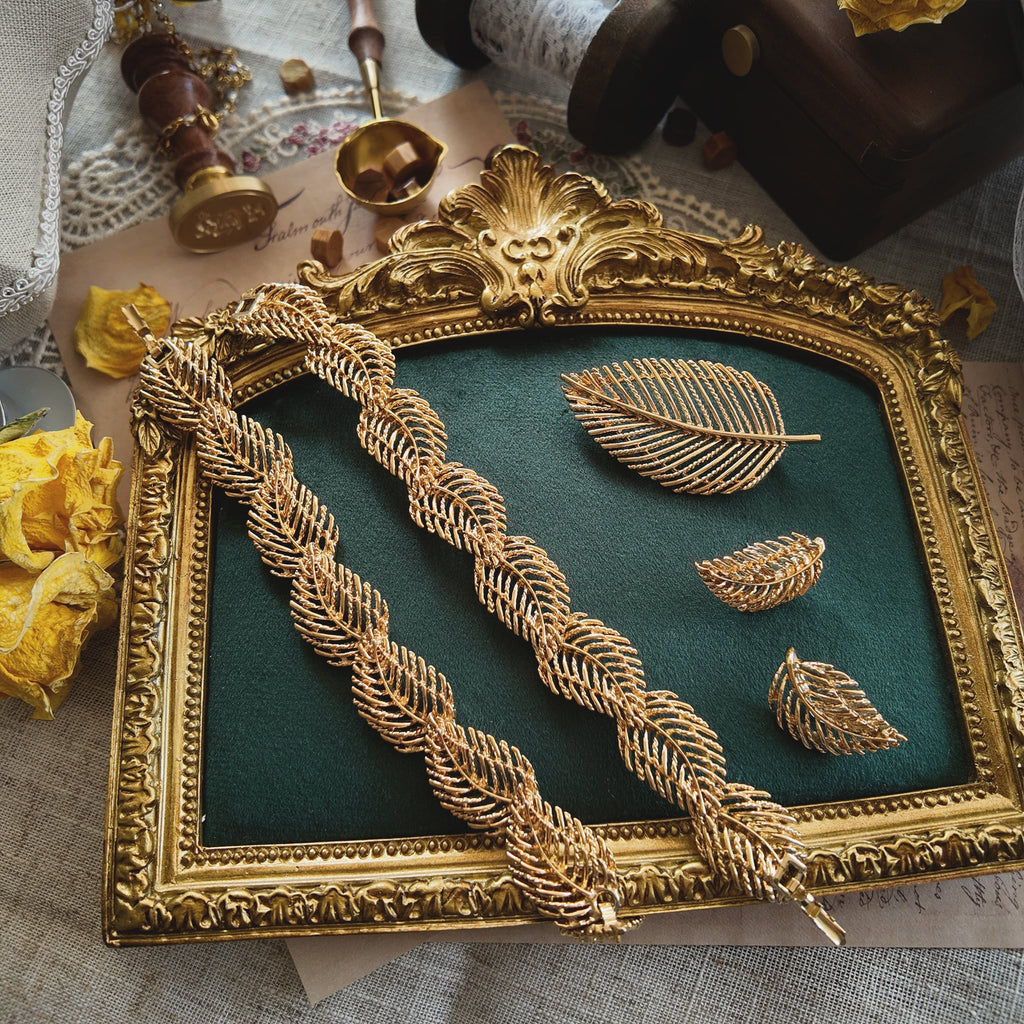 The complete "Secret of the Golden Leaf" vintage Napier parure, including the convertible necklace, the matching statement brooch, and the elegant leaf earrings.