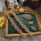The complete "Secret of the Golden Leaf" vintage Napier parure, including the convertible necklace, the matching statement brooch, and the elegant leaf earrings.