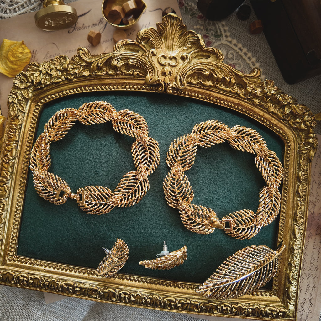 The genius of the Napier convertible design: the necklace separated into two identical 7-inch golden leaf bracelets, a key feature of this patented jewelry.