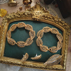 The genius of the Napier convertible design: the necklace separated into two identical 7-inch golden leaf bracelets, a key feature of this patented jewelry.