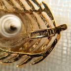 A macro shot of the necklace clasp, clearly showing the authentic "NAPIER" signature and the historically significant "PAT. 4,774,743" mark.