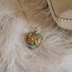 Flatlay photography of the vintage component necklace surrounded by natural elements and vintage aesthetics.