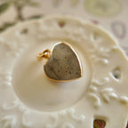 Texture detail of natural labradorite showing the hidden blue and gold flash as the stone is moved.