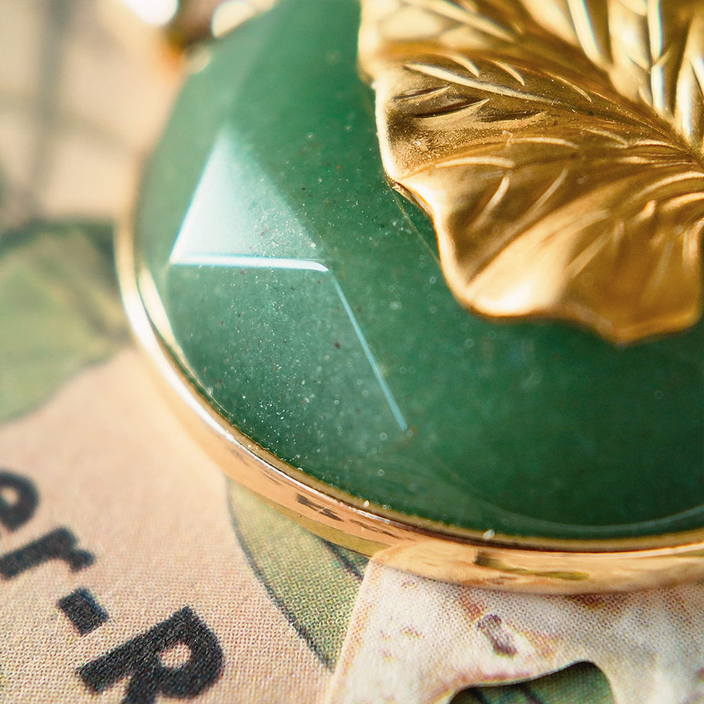 A macro shot detailing the natural, mossy green inclusions within the semi-translucent Green Aventurine, a key feature of this **beautiful spiritual stone**.