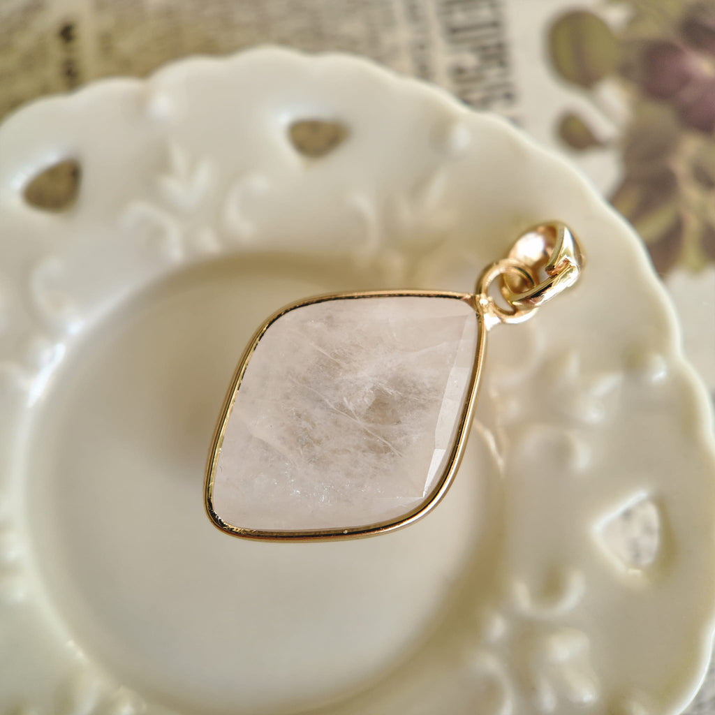 Texture detail of natural white quartz rhombus showing its semi-translucence and unique icy inclusions.