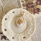 Atmospheric flatlay photography of the vintage component necklace, styled to evoke nobility, strength, and an unbroken spirit.