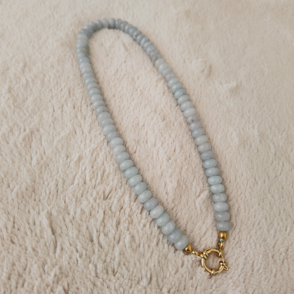 The "Arctic Serenade" necklace styled on a grey cashmere sweater to emphasize its "Icy Romance" and "Quiet Luxury" aesthetic, a piece of timeless, organic luxury.