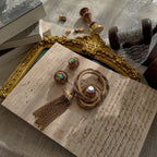 The "Echo of Opulence," an extremely rare vintage Vendôme demi-parure by Coro, featuring a woven gold tassel brooch and matching earrings with AB crystals.