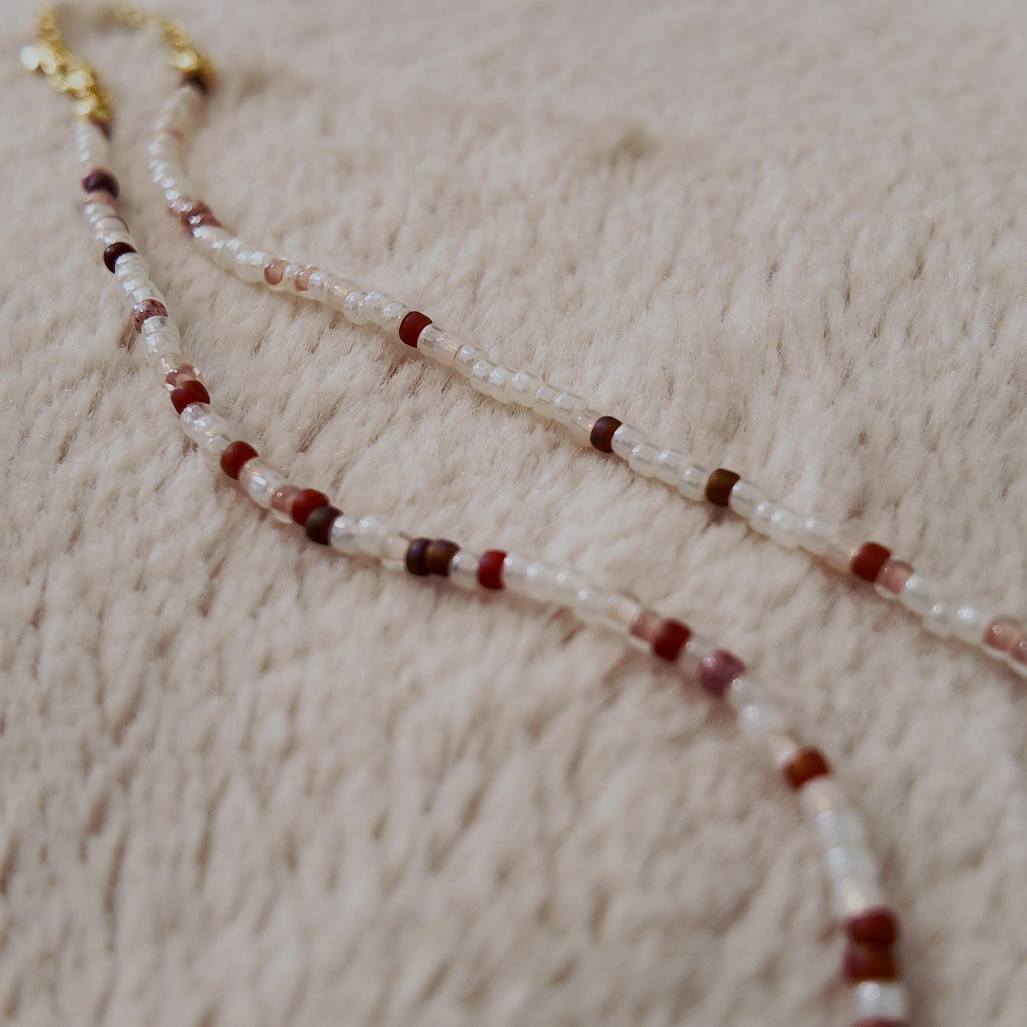 The "Sacred Healer" choker styled with a white rose and a drop of red to emphasize its "Sacred Romance" and "Clinical Chic" aesthetic, a talisman of redemption.