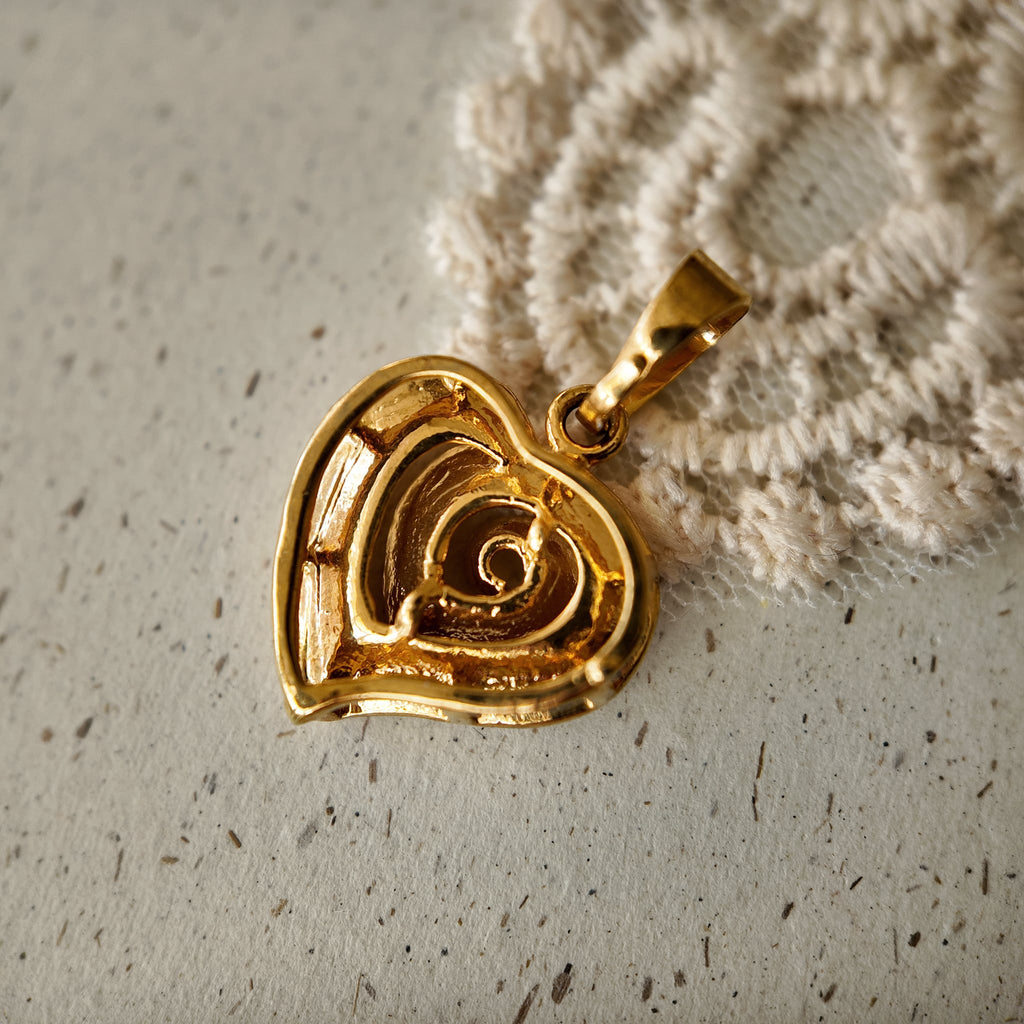 The reverse side of "The Sunset Vortex" pendant, showing the clean construction and craftsmanship of this piece of artisan-reimagined vintage jewelry.