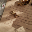The reverse side, showing the authentic "AVON" signature, as well as some minor, expected tarnishing, a sign of its authentic vintage journey.