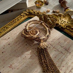 The reverse side of the brooch, showing the authentic "Vendôme" signature, as well as noticeable imperfections and wear at a connection point.