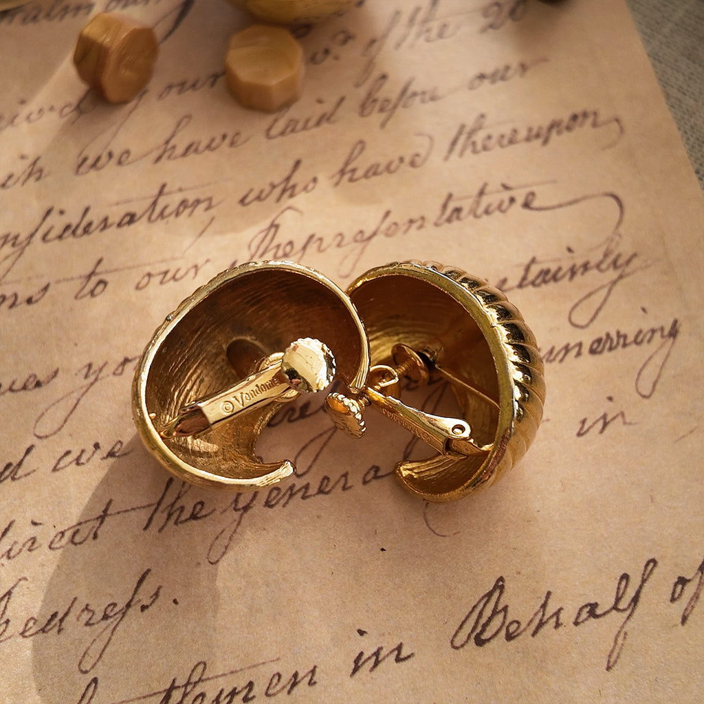 A close-up of the reverse side, showing the authentic "VENDÔME" signature on the clip, as well as visible wear to the plating, sold as-is.