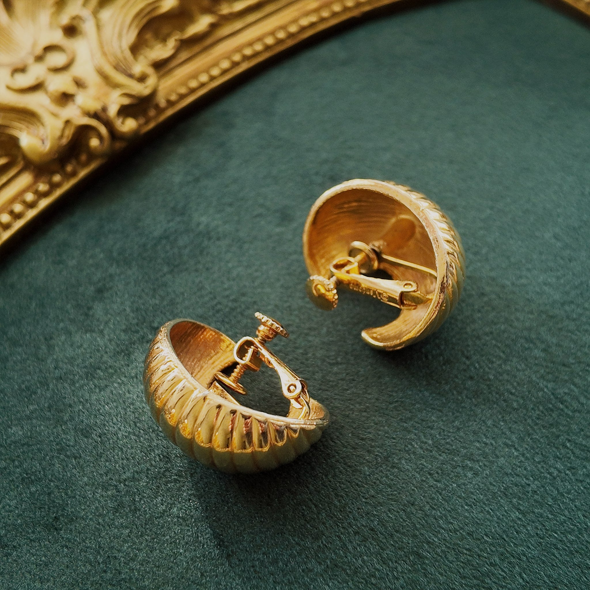 A close-up of the reverse side, showing the authentic "VENDÔME" signature on the clip, as well as visible wear to the plating, sold as-is.