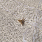 The reverse side of the "Siren's Farewell" charm, showing the smooth, polished 14k gold-plated setting and the elegant, sturdy bail.