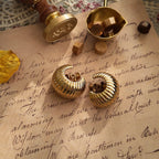 The Vendôme "SoHo Loft" earrings styled on a map of New York City to emphasize their intelligent, urban aesthetic and their identity as "everyday armor" for the modern woman.