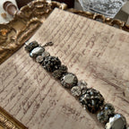 The "Forbidden Scholar," a heavy, ornate vintage Sorrelli statement bracelet designed in the Dark Academia aesthetic with hematite and black diamond crystals.