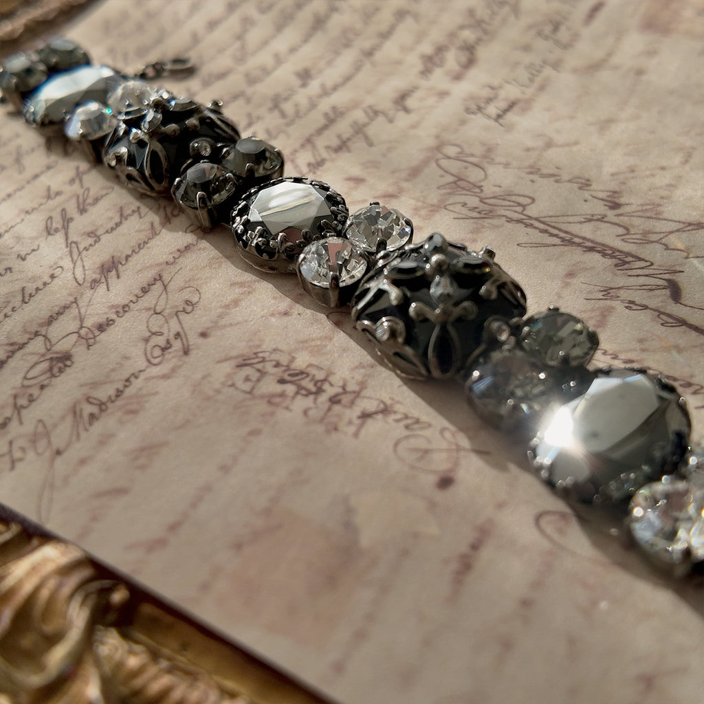 The "Forbidden Scholar," a heavy, ornate vintage Sorrelli statement bracelet designed in the Dark Academia aesthetic with hematite and black diamond crystals.