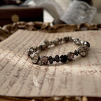 The "Rebel Poetess," a vintage Sorrelli bracelet featuring a charming mix of pink, black, and clear crystals in an antiqued silver-tone setting.