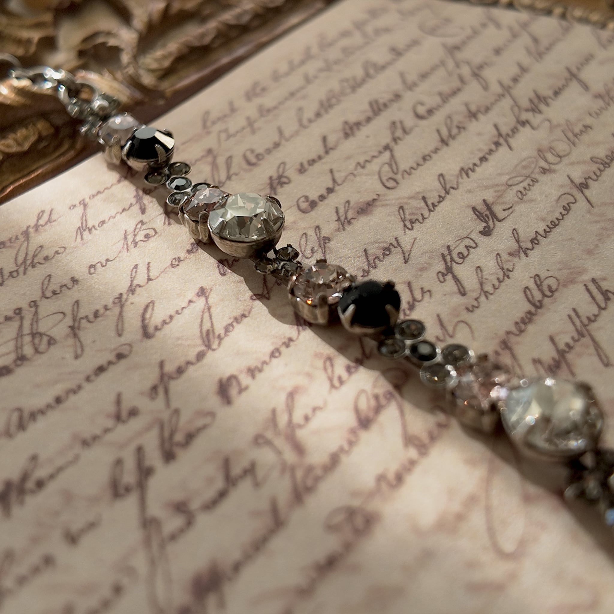 An angled view of the "Rebel Poetess" Gothic Lolita bracelet, highlighting the intricate, multi-stone links and the quality of Sorrelli's craftsmanship.