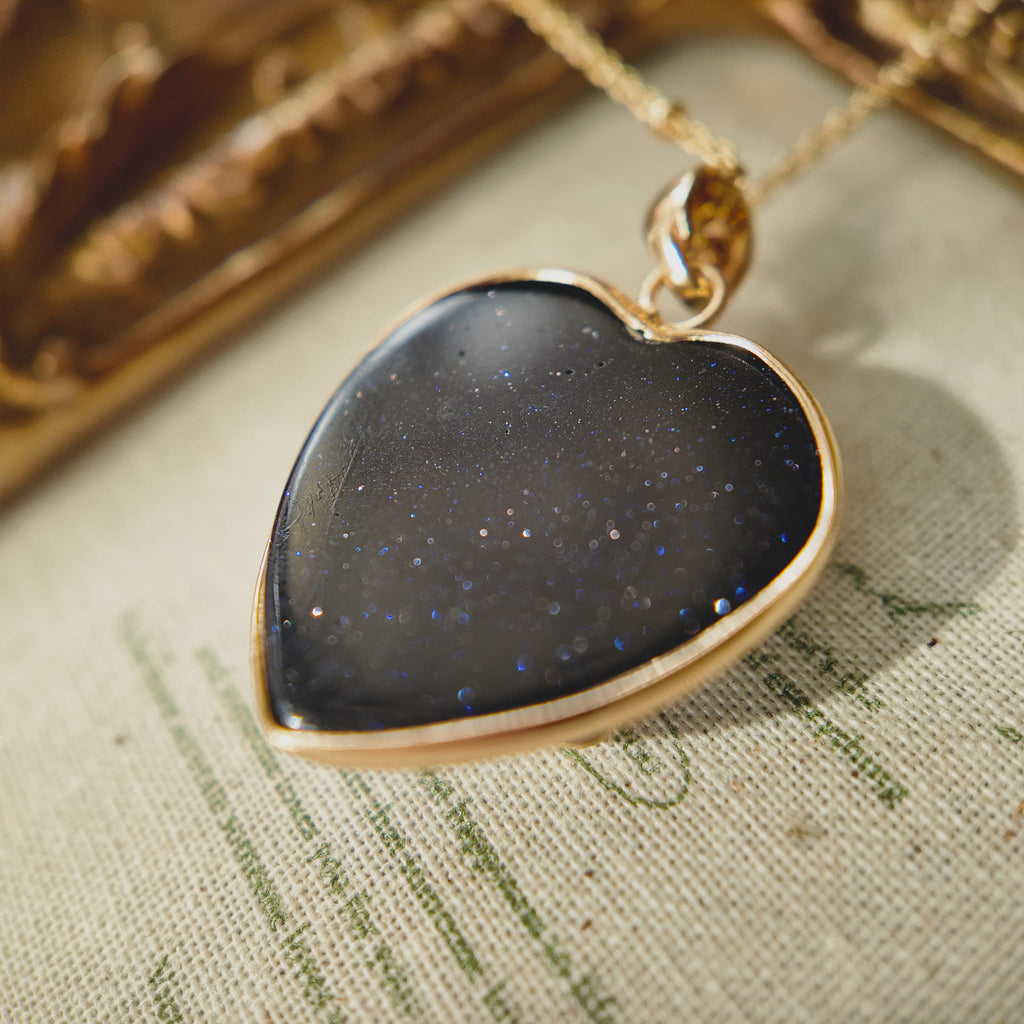 Texture detail of natural blue sandstone showing deep blue color with thousands of sparkling flecks mimicking a galaxy.