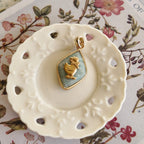 Playful flatlay photography of the vintage component necklace, styled to evoke a storybook character and whimsical mood.