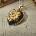 Side profile of the pendant showing the solid grounding weight of the stone and the bezel setting.