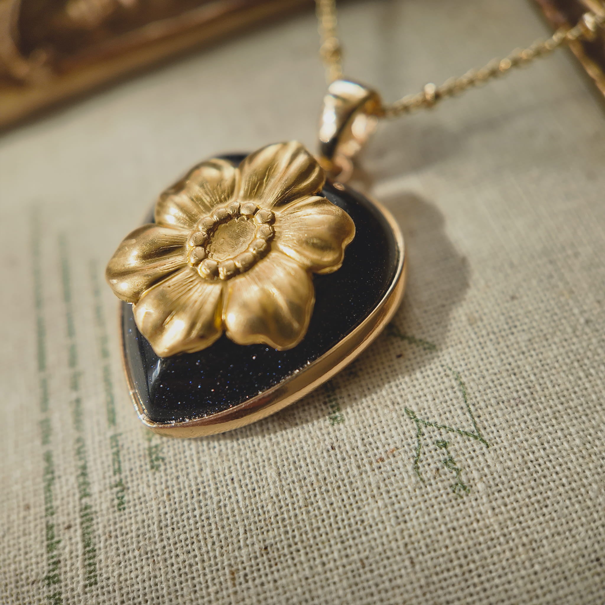 Side profile of the pendant showing the solid grounding weight of the stone and the bezel setting.