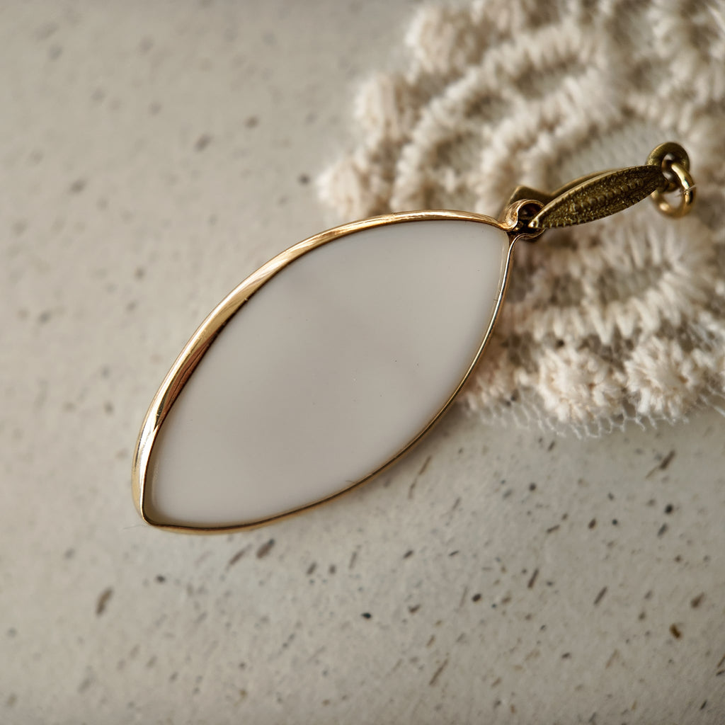 The reverse side of the fairycore-inspired "Ticket to Dreamland" pendant, showcasing the clean bezel setting and the quality of the handcrafted assembly.