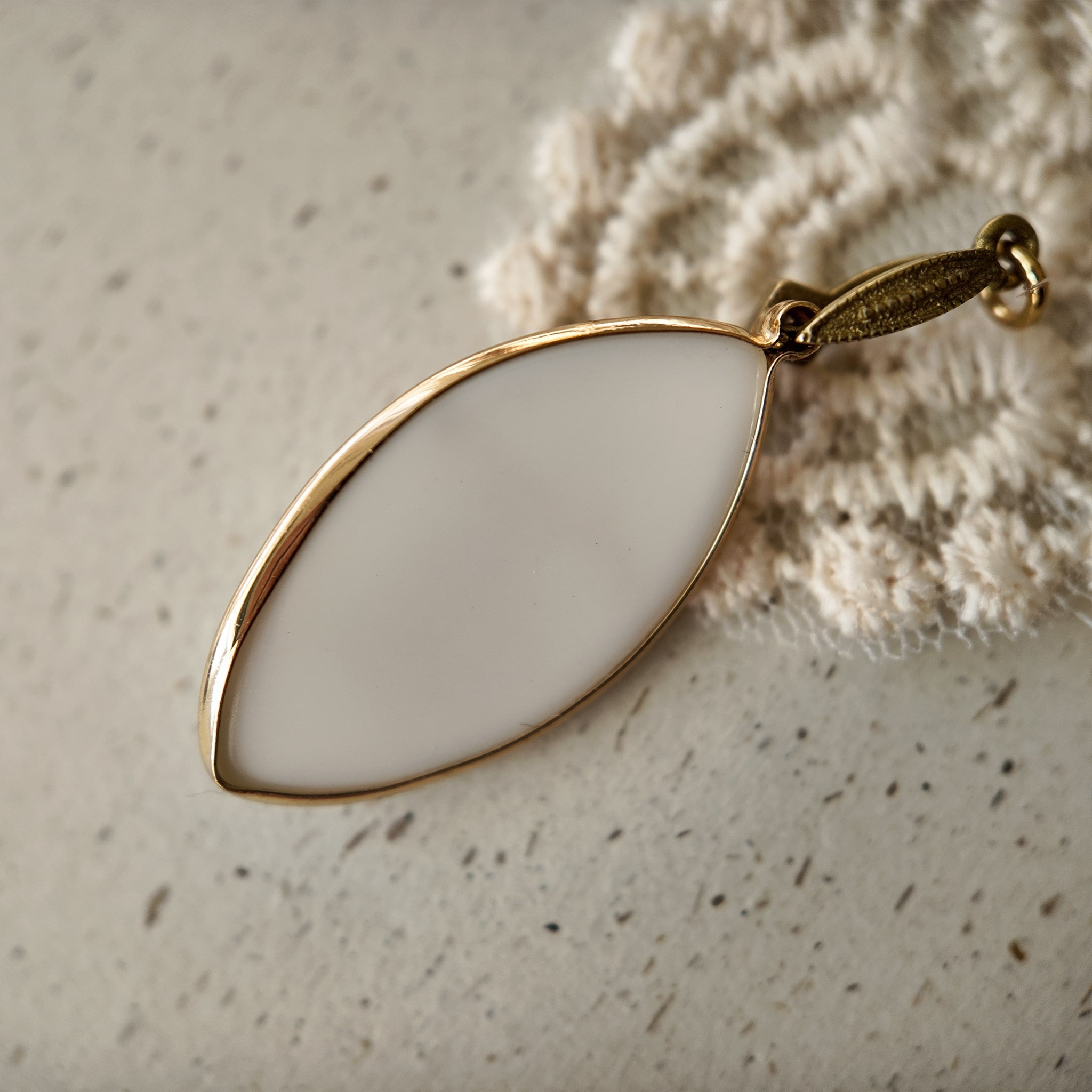 The reverse side of the fairycore-inspired "Ticket to Dreamland" pendant, showcasing the clean bezel setting and the quality of the handcrafted assembly.