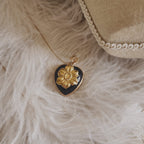 The Character Arc branded packaging, presenting the sparkling pendant as a gift of passion and resilience.