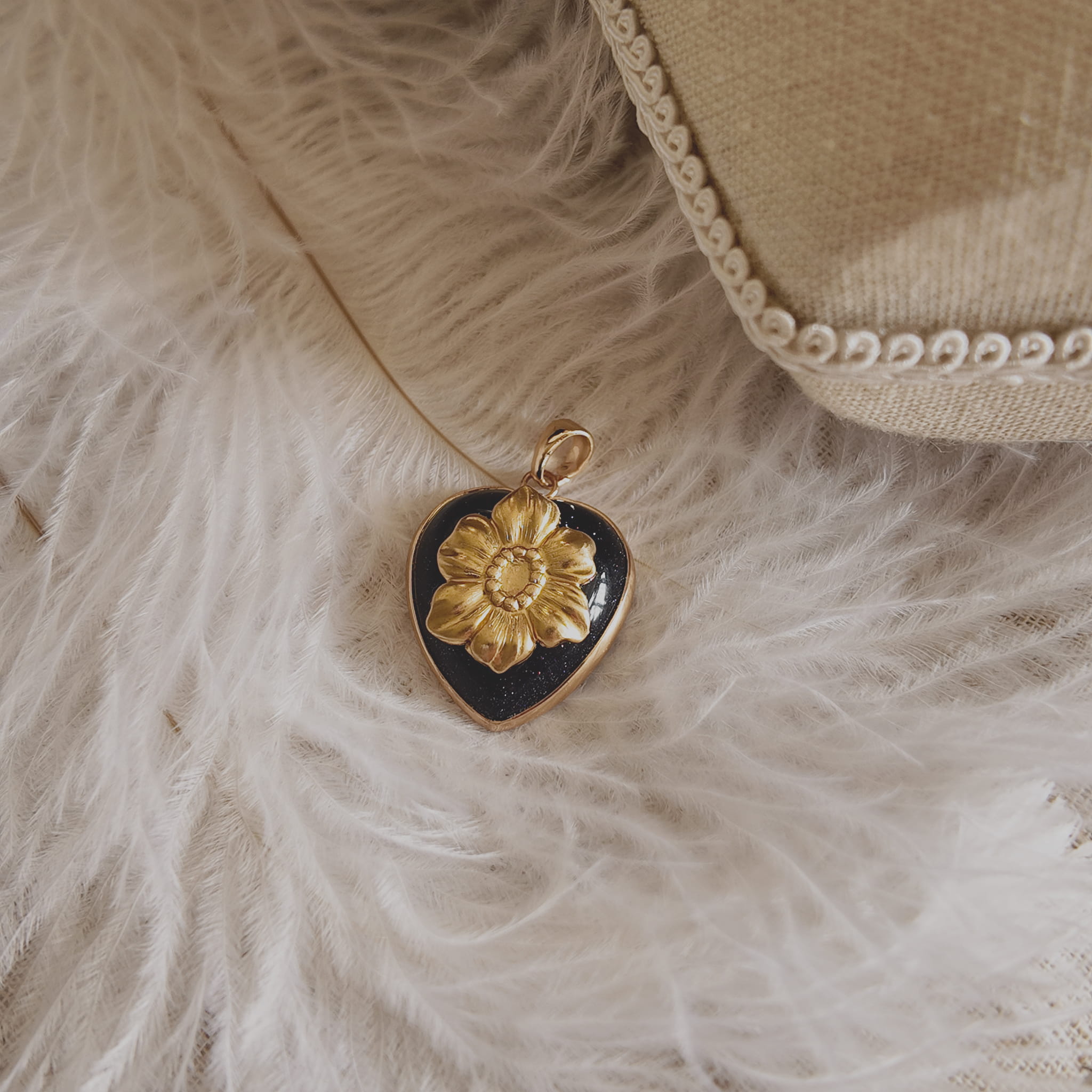 The Character Arc branded packaging, presenting the sparkling pendant as a gift of passion and resilience.