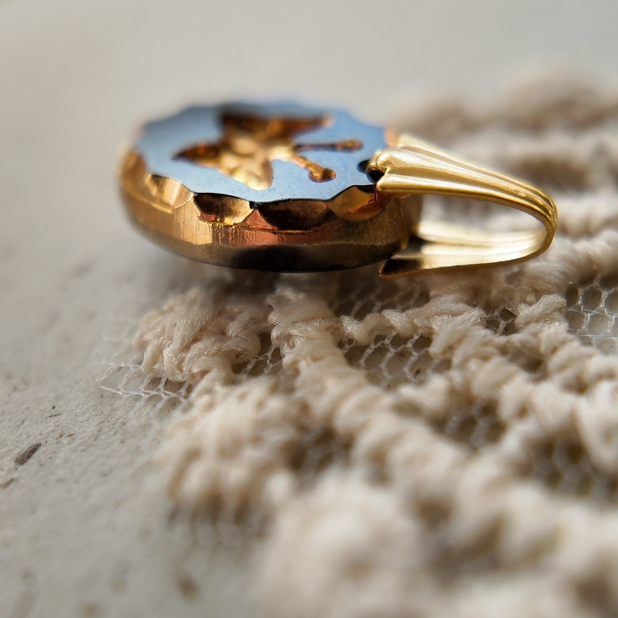 An angled view of the "Shadow Butterfly" artisan pendant, highlighting the delicate, micro-miniature size of this piece of upcycled Dark Academia jewelry.