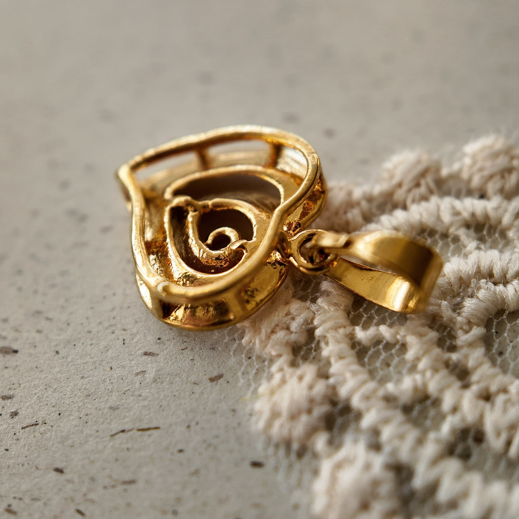 The reverse side of "The Sunset Vortex" pendant, showing the clean construction and craftsmanship of this piece of artisan-reimagined vintage jewelry.