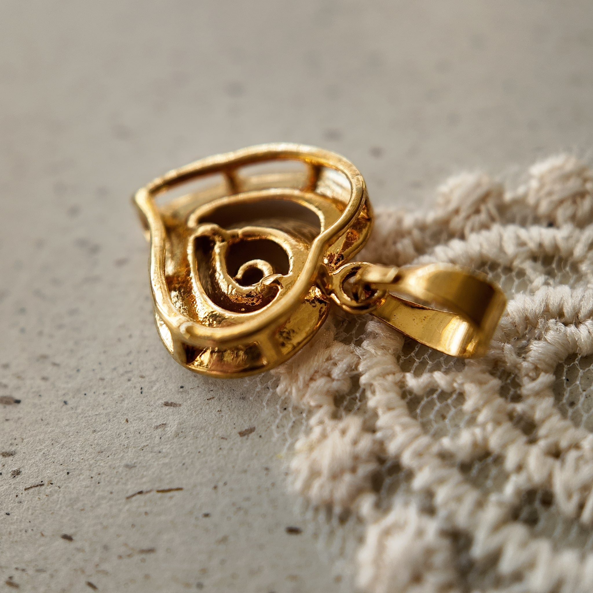 The reverse side of "The Sunset Vortex" pendant, showing the clean construction and craftsmanship of this piece of artisan-reimagined vintage jewelry.